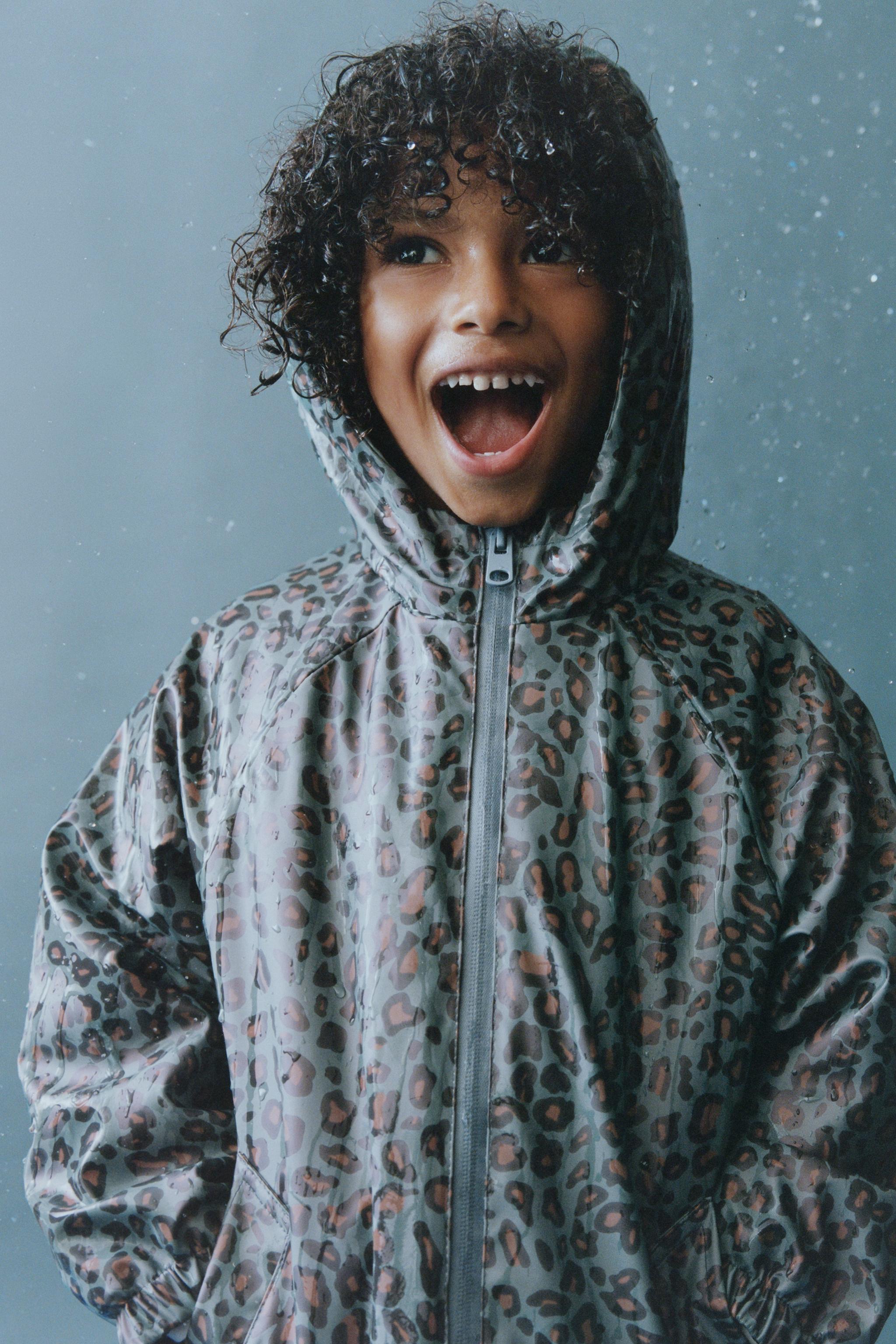 ANIMAL PRINT RUBBERIZED WATER-RESISTANT RAINCOAT WITH FLEECE LINING